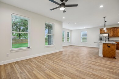 Unfurnished living room with light wood-style flo