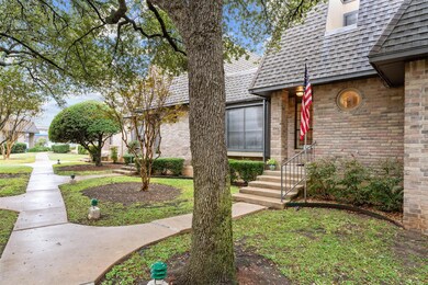View of front of home featuring brick siding and 