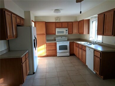 Gorgeous kitchen with refrigerator and range. Also