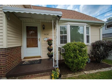 Covered front porch, newer gutters and downspouts.