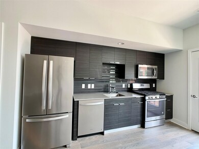 Kitchen featuring stainless steel appliances, a s