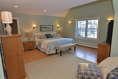 Master bedroom suite with vaulted...