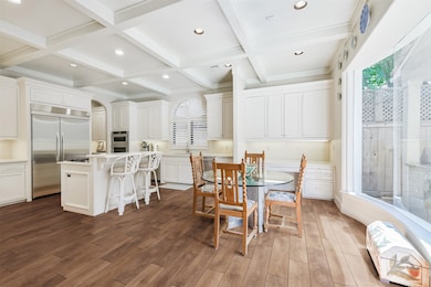 Gourmet kitchen with breakfast bar, walk in pantry and plenty of built in cabinets. *Virtually Renovated Flooring