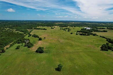 Birds eye view of property featuring a rural view