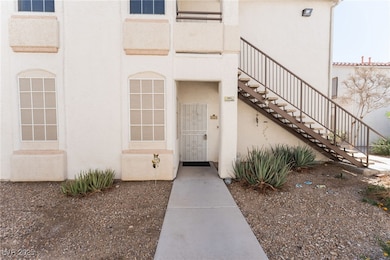 Doorway to property featuring stucco siding