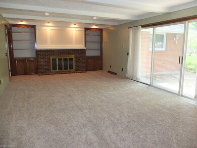 Family room with fireplace and slider to patio.