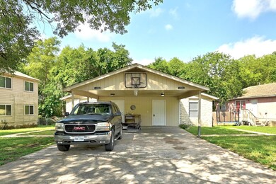 View of front of property with a front lawn, driv
