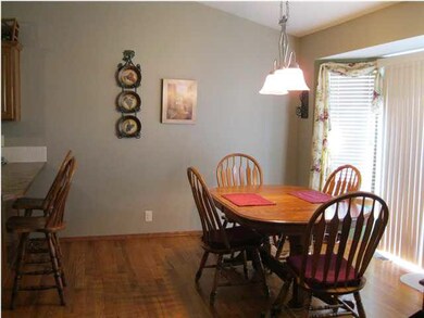 Dining room with wood floors and access to deck fo
