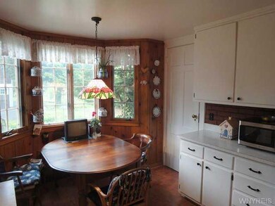 Kitchen. Bay window. Doorway to second staircase.