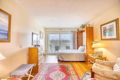 Bedroom featuring a textured ceiling, access to ex
