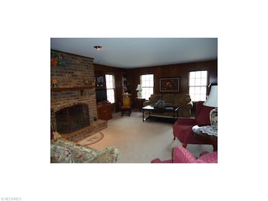 Comfortable Family Room 20x16 with brick woodburni