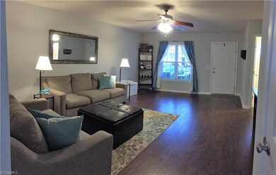 WOW what a great living room as seen from the hallway leading to the kitchen. On the left is the closet door.