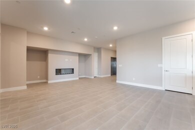 Unfurnished living room with a glass covered firep