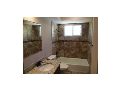 Hall bath with new vanity granite sink and tiled s