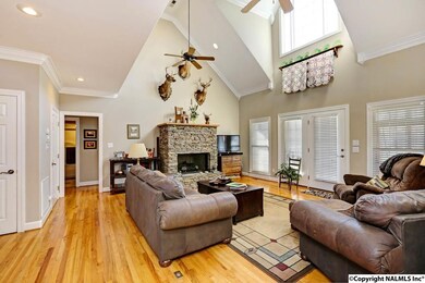 Beautiful wood floors grace the living areas of the home.  The natural gas fireplace features stacked stone with a custom mantel.  The foyer, living room and master bedroom have been freshly painted.