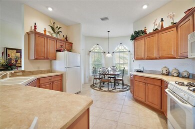 Eat in kitchen with wood cabinets and plenty of counter space
