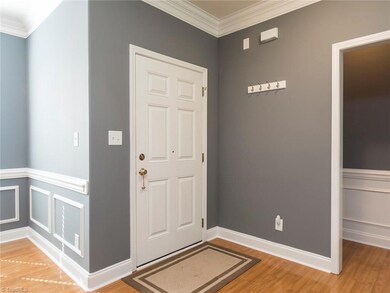 Elegance greets you at the entry.  Gorgeous trim work, hardwood floors and neutral colors work together to create an inviting space for you and your guests!