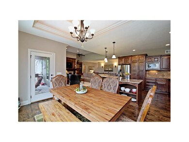 The eating area off the kitchen area and it leads 