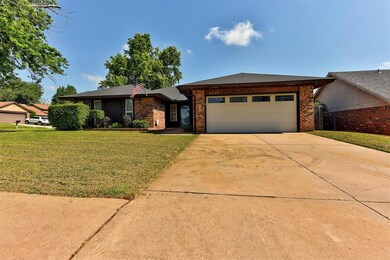 View of front with a garage and yard