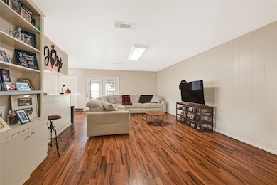 Spacious family room offering flexibility for gatherings, entertainment, or relaxation.