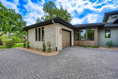 View of side of home featuring an attached garage
