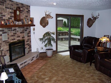 View of family room, patio doors to lower rear dec