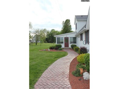 Follow the red brick walk to enter the sunroom at 