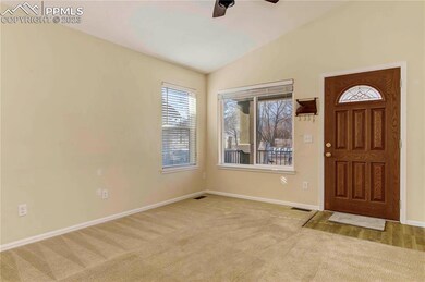 Front living room has large picture window, allowi