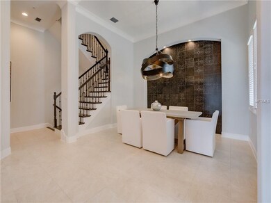 Entry way opens to the formal dining room.
