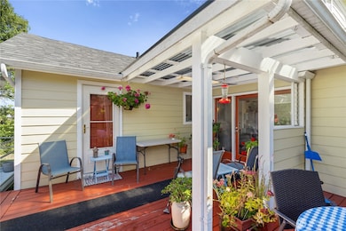 Partially covered back deck on west side of home