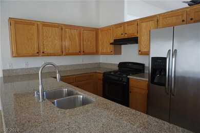 Kitchen with granite counters. Refrigerator stays!