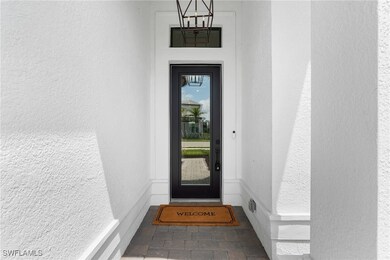View of exterior entry featuring stucco siding