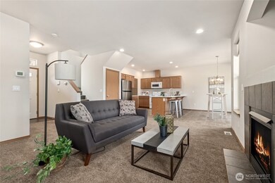 Open-concept design connects living, dining & kitchen for an effortless flow. High ceilings add to the main floors spacious feel.