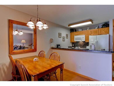 Dining Room. The newly remodeled open kitchen makes if convenient to entertain and visit.  The table is perfect for dining, cards & games.