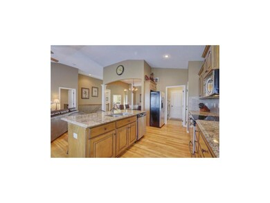 Large kitchen island boasts granite counter top!