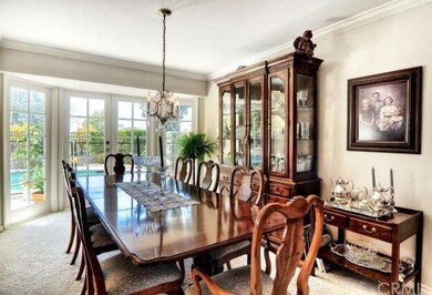 Formal dining room features crown molding with Fre