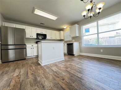 Kitchen with stainless steel appliances, a chande