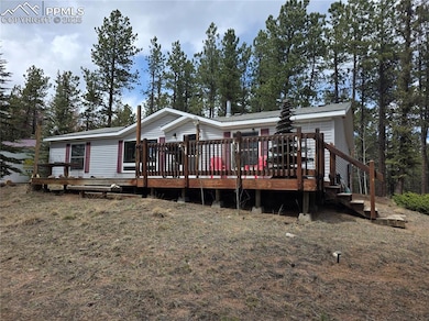 Rear view of property featuring a deck