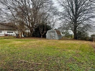 View of yard featuring a storage unit