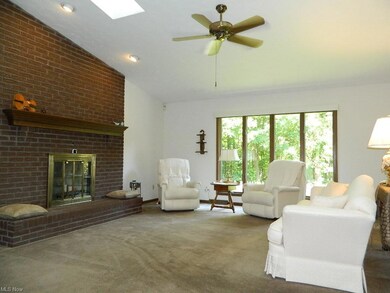 Vaulted Family Room with Two Skylights and Wood Bu