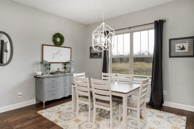 Dining room is so ample too that a large farmhouse table would gleam in this space!  So nice and bright.