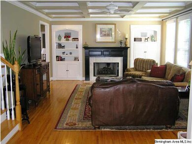 Large family room with fireplace and coffered ceil