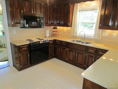 Spacious Eat-in Kitchen boasts Raised Panel Cabine