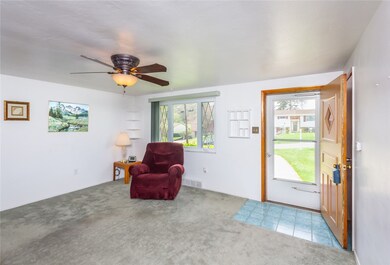 Beautiful hardwood floors under wall-to-wall carpe
