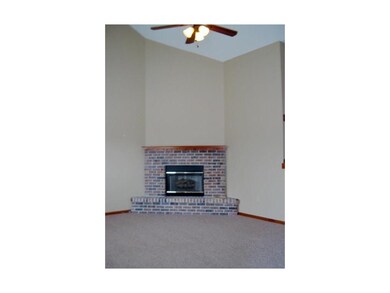 Vaulted ceiling and masonry fireplace gives the Gr