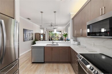 Kitchen featuring sink, ornamental molding, kitche