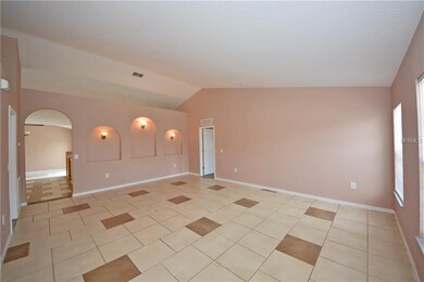 Large living room has cathedral ceiling, display c