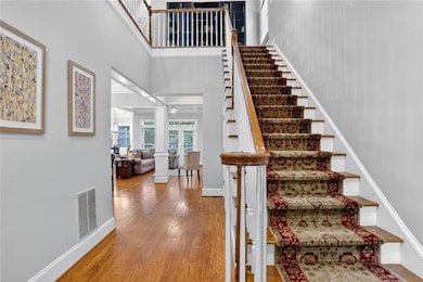 Staircase to the 2nd level.  Hardwoods on the main level.