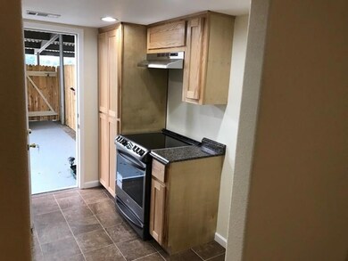 Kitchen that exits to back patio and rear parking
