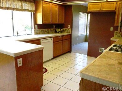 Large open kitchen with tile counters & backsplash